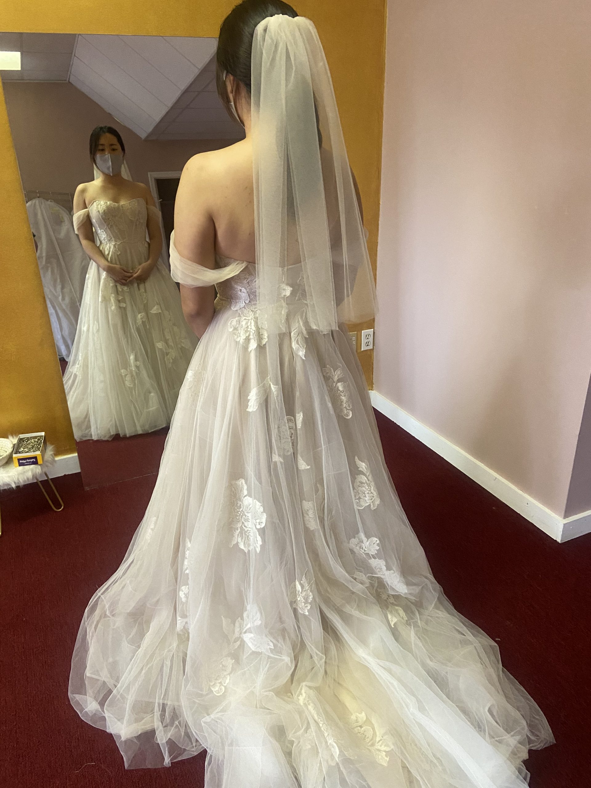 custom veil and sleeves, hemmed, and bustle